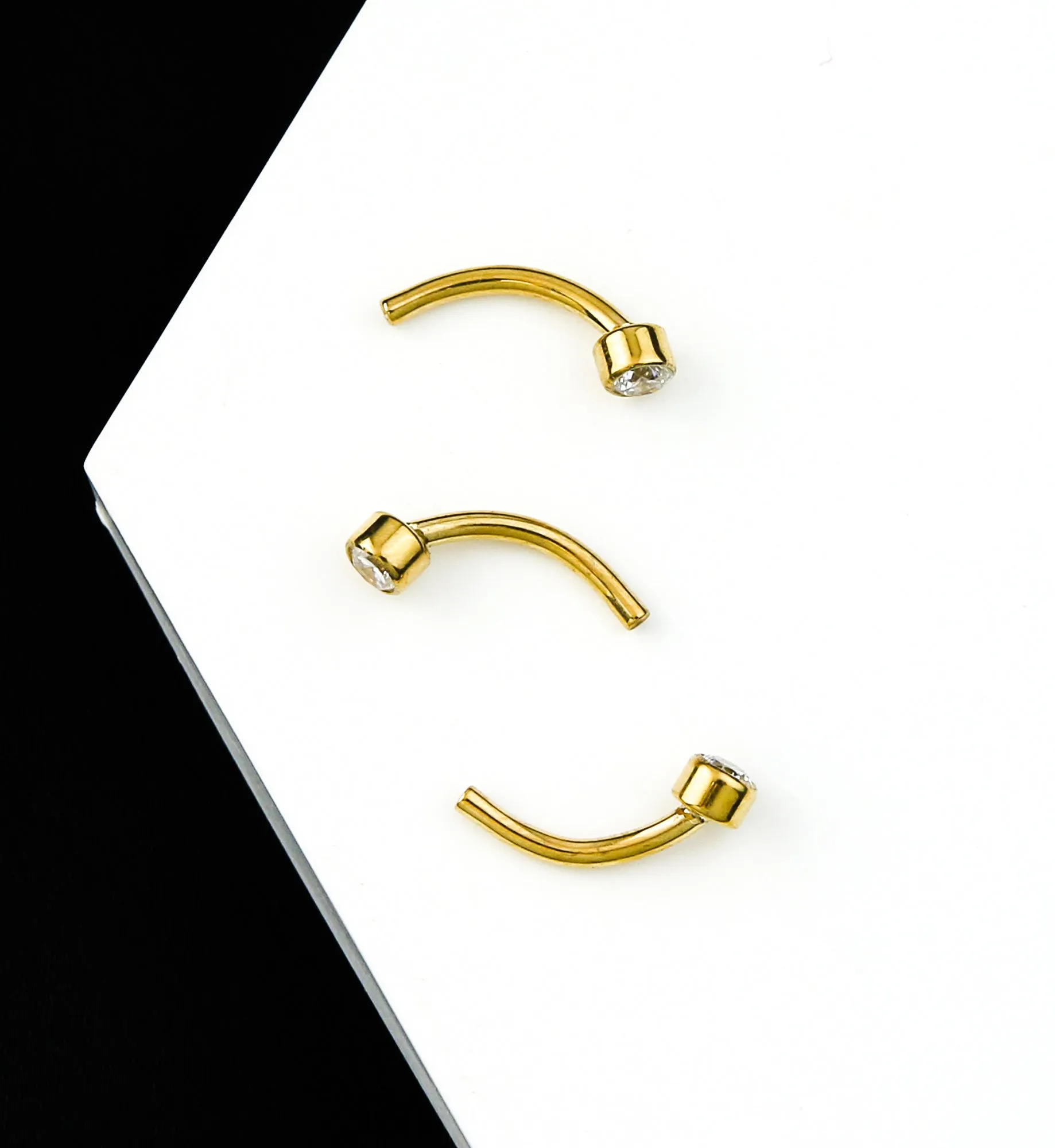 24kt Gold PVD Bezel Clear CZ Titanium Threadless Curved Barbell